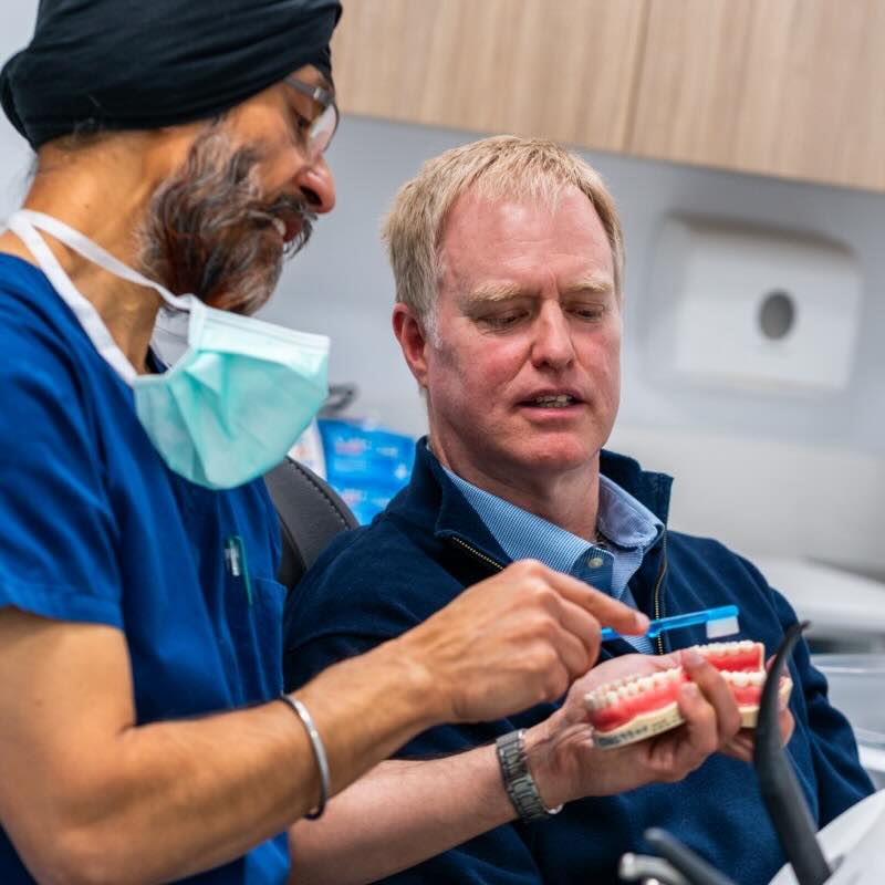 Deakin Dental Mildura - Caring Dentist Explaining Procedure to Dentrophobic Patient